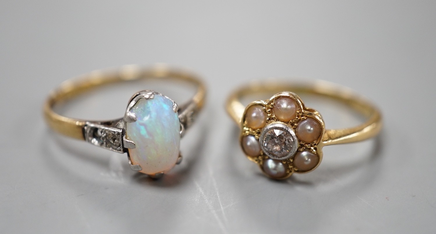 An 18ct and Plat, split pearl and diamond cluster set ring, size F/G and a similar white opal set ring with diamond set shoulders, size L, gross weight 4 grams.